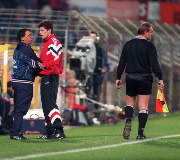 England manager Graham Taylor tells the linesman he had "got him the sack" after not sending off Koeman for a blatant foul on David Platt