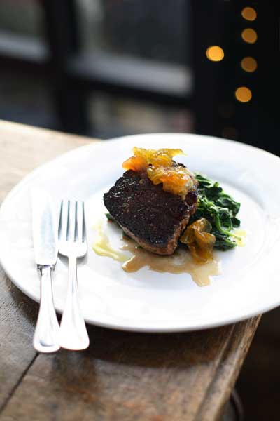 Lay the beef alongside the chard and spoon a tablespoon of mustard fruit on top of the beef