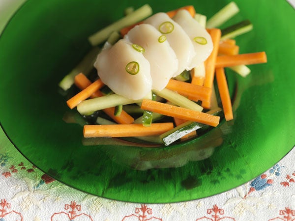 Lay the scallops on top the carrots and cucumber and spoon over the vinegar