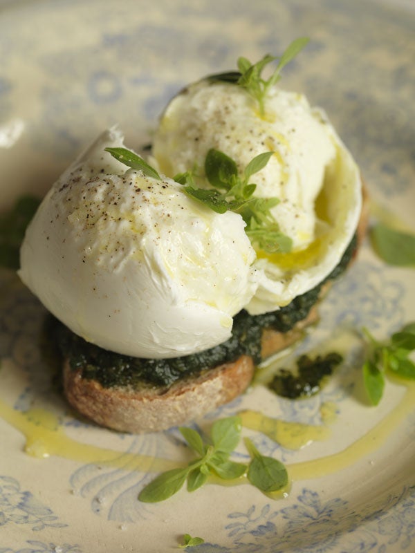 Place the mozzarella on the sourdough, spoon the olive oil over and scatter with basil leaves