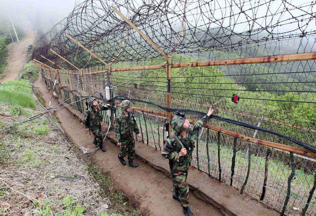 South Korean soldiers patrol along the demilitarised zone between South and North in Yanggu, north of Seoul