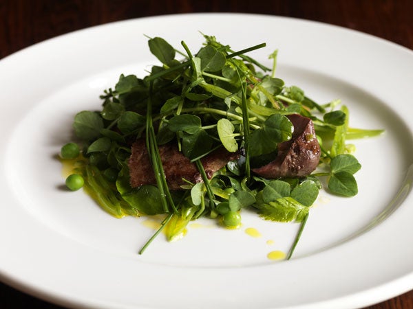 Arrange on serving plates with the offal arranged in among the leaves and scatter the chives on top