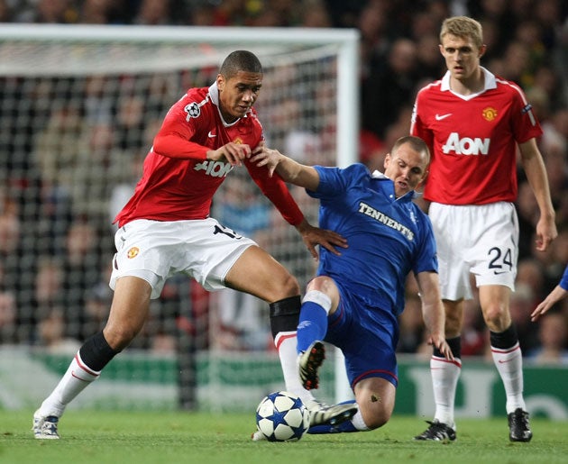 Smalling (left) knows he is facing a spell back on the substitutes' bench after Rio Ferdinand's return from injury