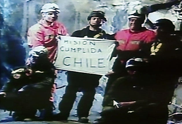 "Mission accomplished." A video image shows rescuers still underground celebrating after the Phoenix rescue capsule carrying the last of the 33 trapped miners left the mine in Copiapo