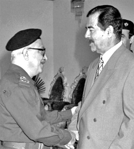 Tariq Aziz and Saddam Hussein in 1998