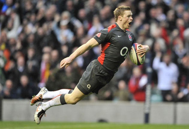 Chris Ashton leaps in to score after his brilliant sprint through the Australians at Twickenham