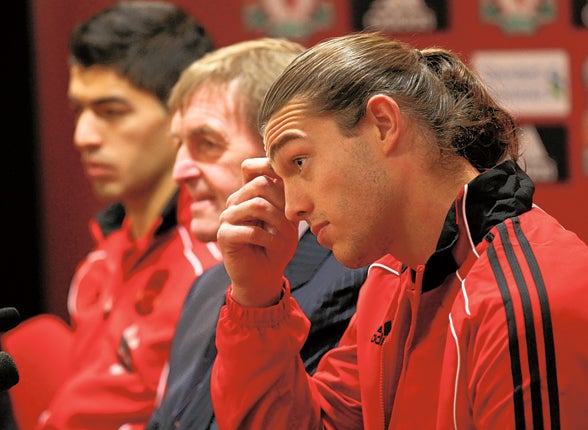 Luis Suarez and Andy Carroll with Kenny Dalglish at Anfield