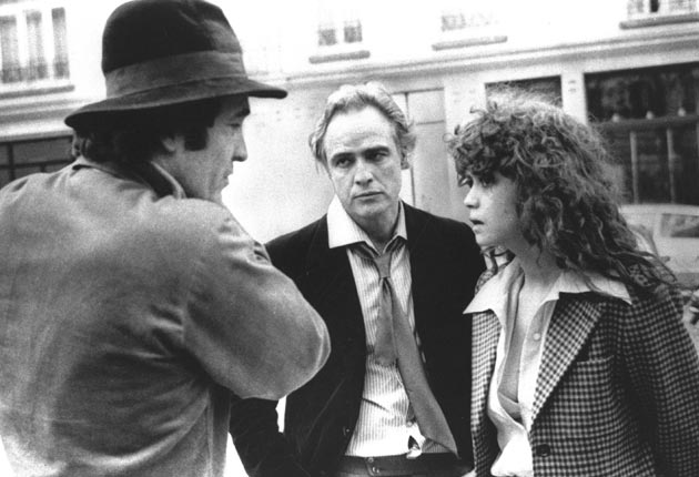 Bertolucci with Marlon Brando and Maria Schneider on the set of ‘Last Tango in Paris’ (AP