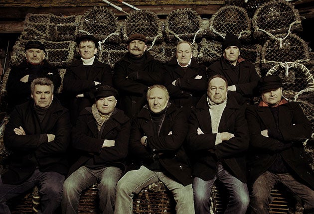 The Fisherman's Friends grew up in the same village and have been singing together for 16 years - Trevor Grills pictured back row, second from right.