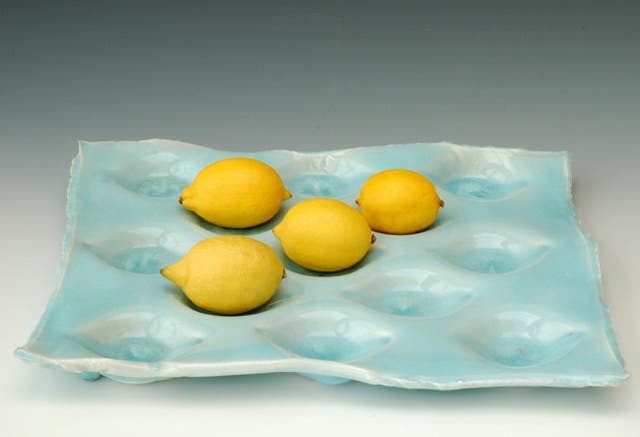 {1} FRUIT TRAY<br/>Make the fruit the centre ofattention with a dimpled traymade to order by ceramic artist Joanna Howells. Choose from a restrained speckled parchment finish or go crazy with a tray iniridescent sky blue.<br/>£85, notonthehighstreet.