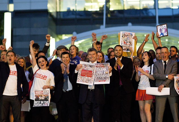 Staff at the News of the World, including editor Colin Myler, centre, leave the building at Wapping for the last time after the final edition of the paper was finished in 2011