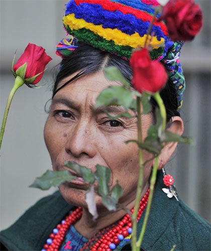 Villagers from Las Dos Erres protested with red roses at the trial