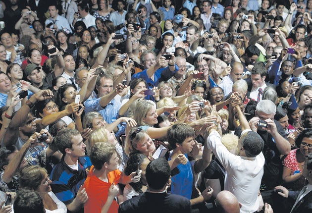 Barack Obama (foreground, right) greets supporters in Chicago on his 50th birthday