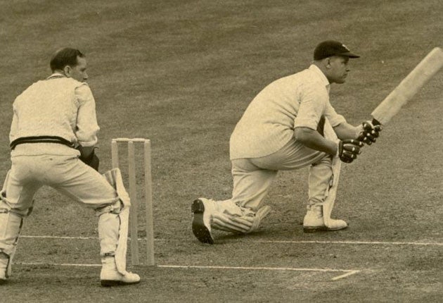 Watkins (right) on his way to a century for Glamorgan in 1949, watched by Surrey's Arthur McIntyre