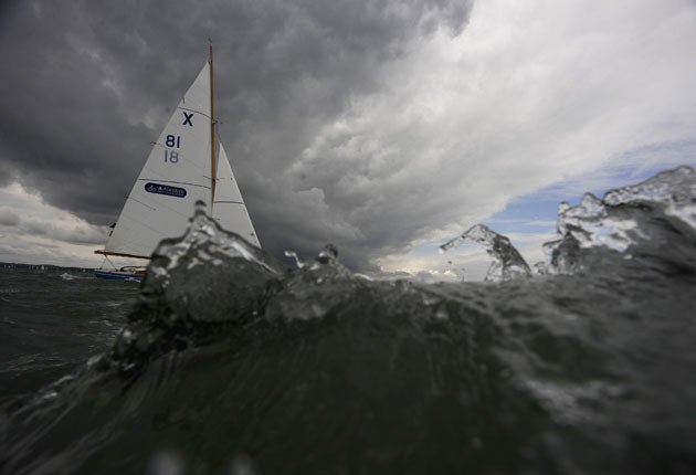 Charlie Field and Jo Skinner's X-boat Sapphire on the crest of a wave in AAM Cowes Week