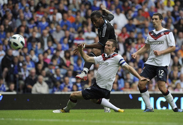 Shoot on sight: The Chelsea forward Didier Drogba strikes out at Ibrox, but he was overshadowed by the 21-year-old Daniel Sturridge, who scored two goals in the friendly against the Scottish champions