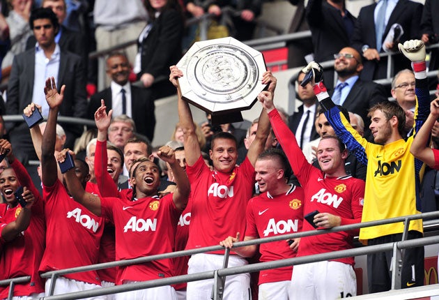 Nemanja Vidic lifts the Community Shield at Wembley yesterday