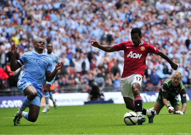 Kompany (left) was at fault for Nani's winning goal