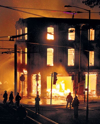 A property burns near Reeves Corner, Croydon, during the riot last night