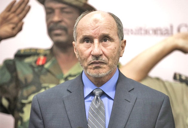 The move by Mustafa Abdel Jalil, above, to dismiss the cabinet was seen as a further split in the rebel movement, following the killing of Abdel Fattah Younes