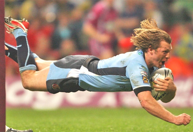 Sean Long scores for St Helens during a Millennium Magic clash with Wigan in 2008