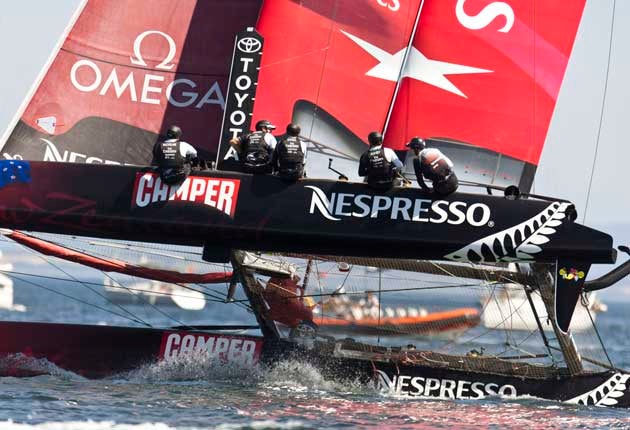 Flying high, Dean Barker's Emirates Team New Zealand on its way to winning the inaugural America's Cup World Series regatta in Cascais, Portugal