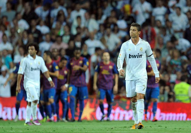 Ronaldo looks frustrated as Barcelona celebrate