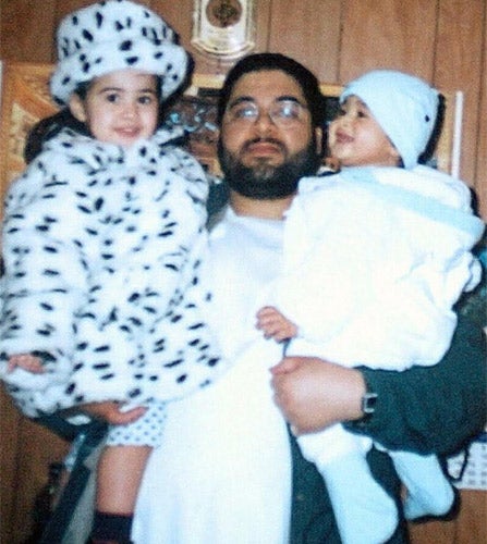 Shaker Aamer holding his daughter Johninh and his son Michael