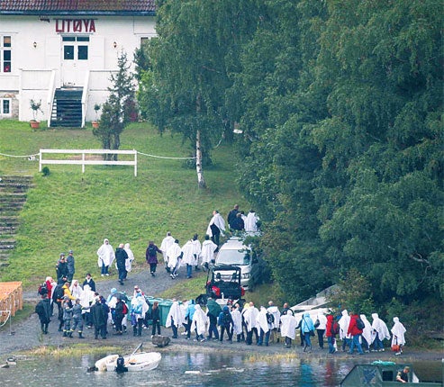 Relatives and close friends of victims arrive at the scene of the massacre on Utoya island yesterday