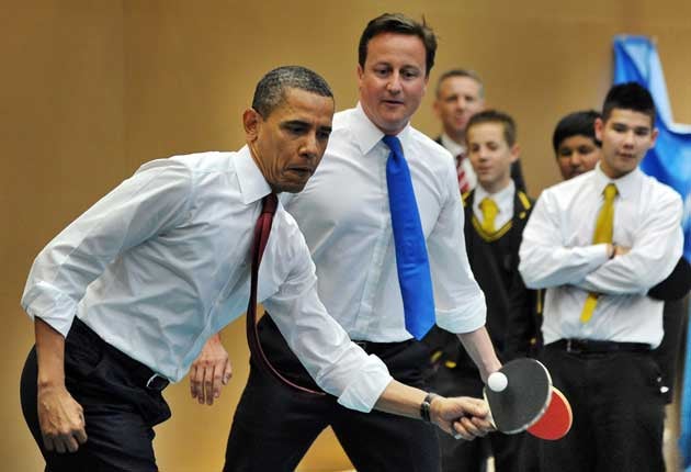 Obama and Cameron play table tennis with students of the Globe Academy school in London