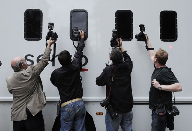 A prison van with riot suspects leaves Westminster Magistrates' Court