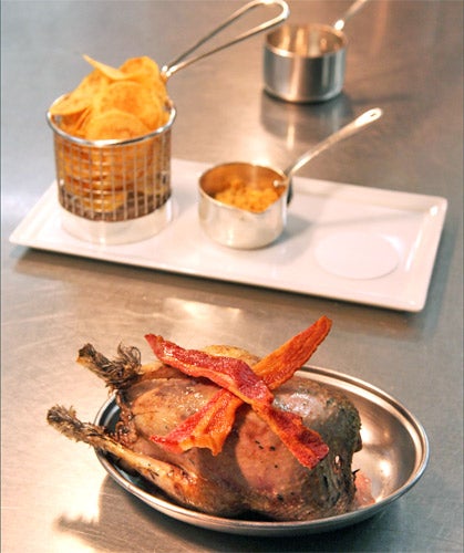 Grouse served in the traditional way, seared in duck fat and dressed with bacon