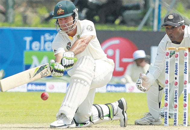 Australia's Ricky Ponting sweeps for a boundary while Sri Lanka's Prasanna Jayawardene looks on during the first day of the first Test in Galle