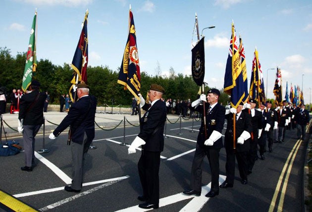 A ceremony to hand over the Union flag from the town of Wootton Basset to the new memorial gardens in Brize Norton