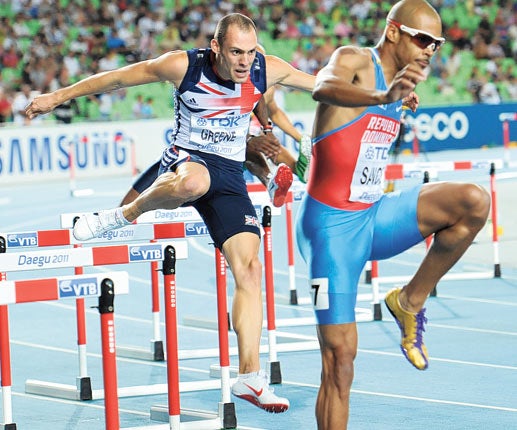 Dai Greene (left) makes up lost ground on his way to gold in the 400m hurdles