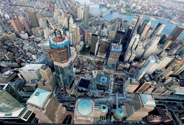 The new One World Trade Centre building overlooks the 9/11 memorial and museum