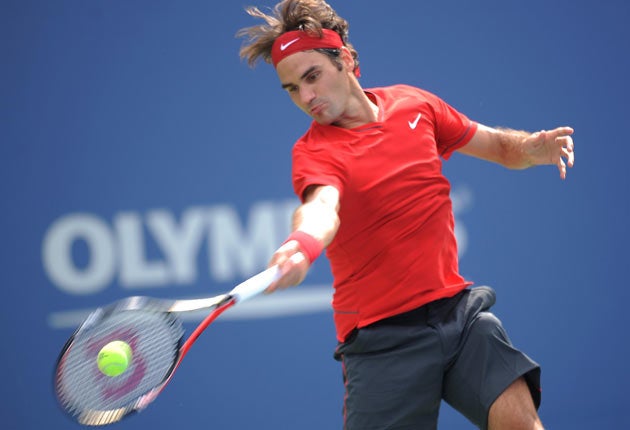 Roger Federer eases to a convincing win, his 225th in Grand Slam tournaments