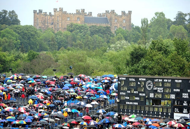 The Riverside crowd take cover on a day marred by inclement weather. The forecast for the Rose Bowl on Tuesday is not much better