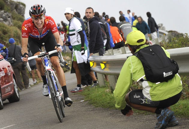 Bradley Wiggins climbs during yesterday's 14th stage