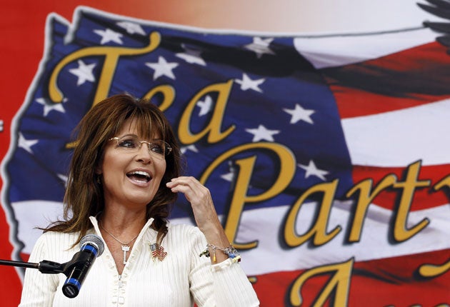 Wooing the crowd: Sarah Palin speaks at a Tea Party rally in Indianola, Iowa