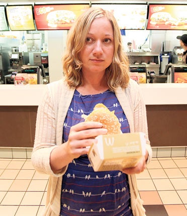 Genevieve Roberts sampling some fast food in a McDonald's