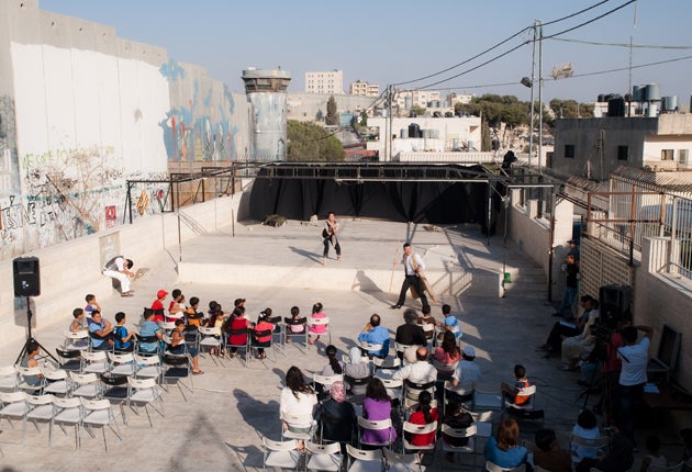 A young Palestinian audience watch The Tempest