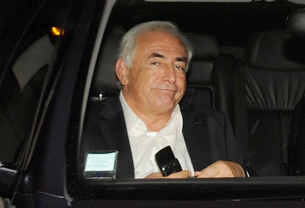 Dominique Strauss-Kahn leaves his home yesterday after being quizzed by police