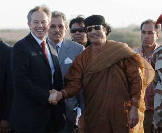 The former PM Tony Blair and Colonel Gaddafi shake hands on 29 May
2007 after an hour long meeting