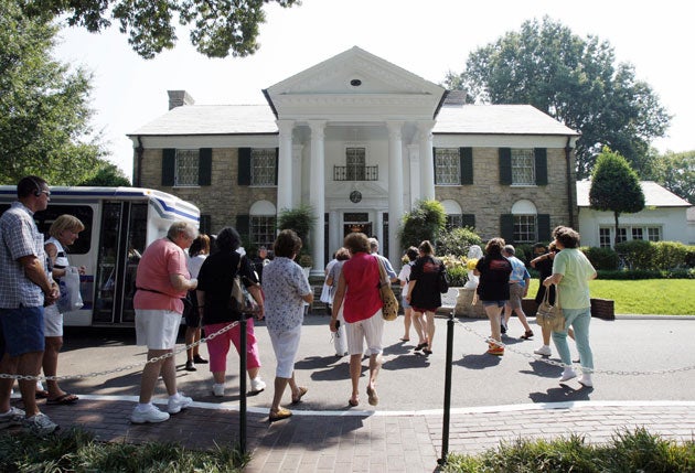 Tourists gather outside Graceland Mansion