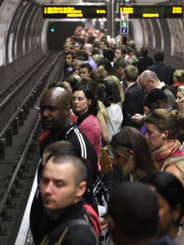 LONDON, ENGLAND - JUNE 11:  Commuters wait to board a tube train in Clapham Common station on one of the few London Underground services operating through the RMT Union's tube strike on June 11, 2009 in London, England. A 48 hour strike began at 7pm on Tuesday after discussions over pay and working conditions between London Underground bosses and the RMT Union failed to reach a conclusion. 