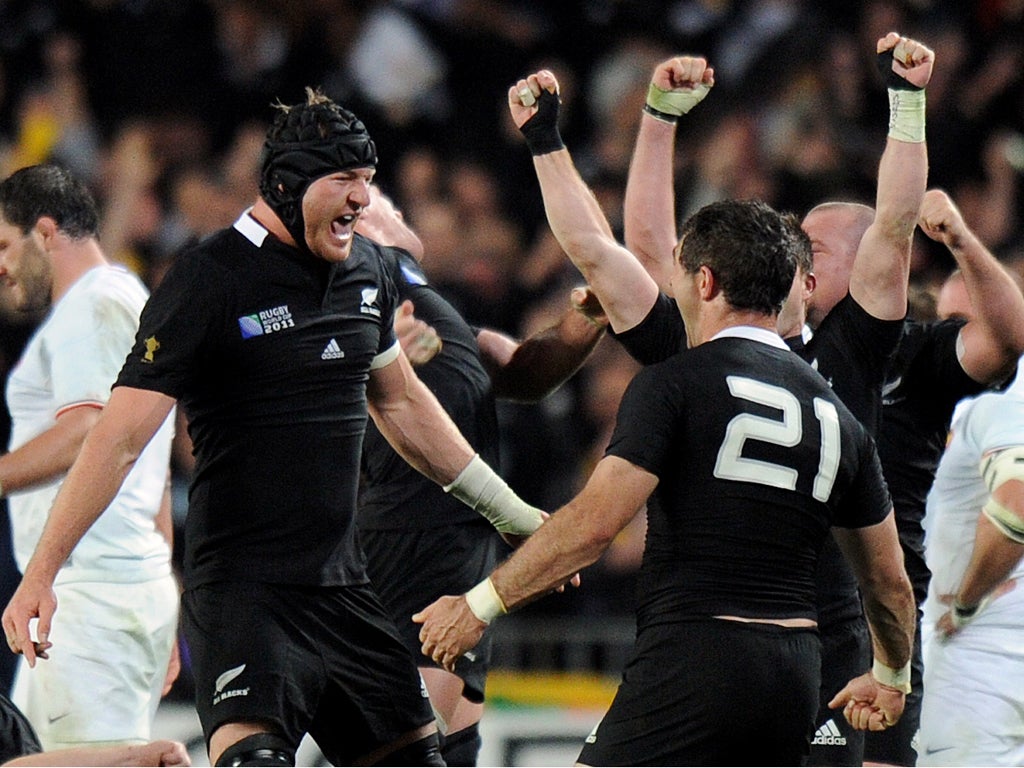 New Zealand All Blacks hooker Andrew Hore (L), Stephen Donald and others celebrate after the 2011 Rugby World Cup final match New Zealand vs France at Eden Park Stadium in Auckland on October 23, 2011.