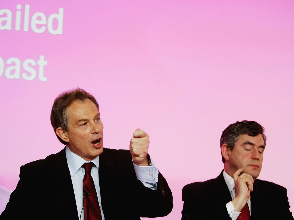 Touching face: While listening to then-PM Tony Blair talk, Gordon Brown shows he disagrees with a point by scratching his chin