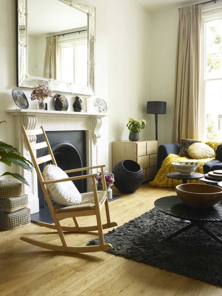 Gray matter: The open-plan living area contains many of the the designer’s own pieces