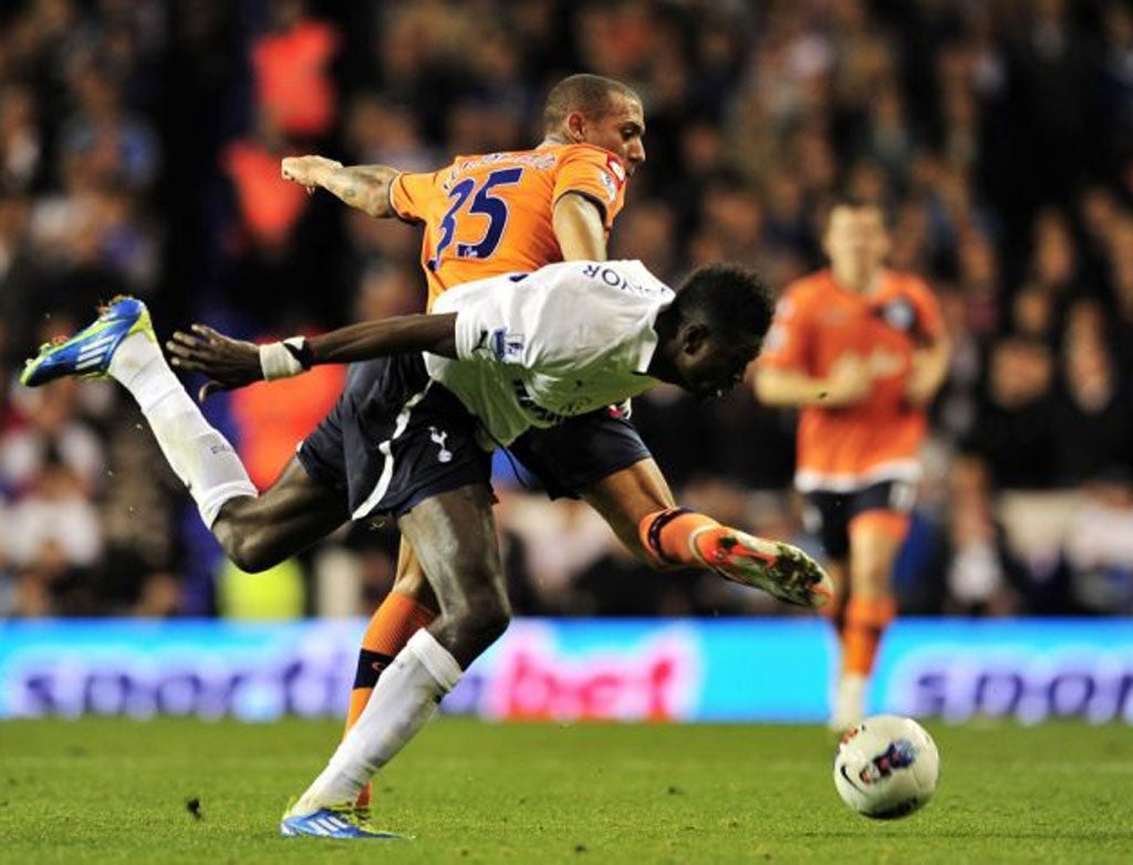 Queen's Park Rangers' Anton Ferdinand battles with Emmanuel Adebayor yesterday